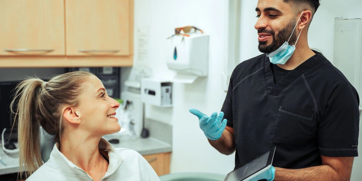 Doctor preforming dental care to patient.